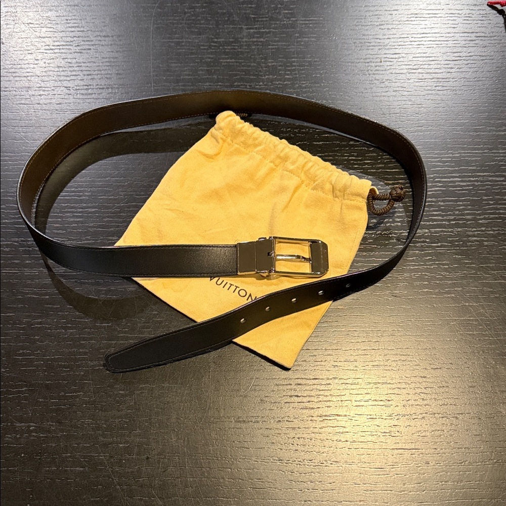 Louis Vuitton, black and brown reversible belts with silver buckle